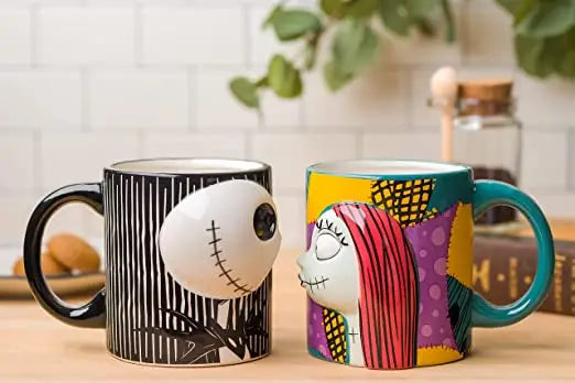 Tim Burton's The Nightmare Before Christmas 20oz Large 3D Mug Set: Jack & Sally Sculpted Cups Displayed on Table